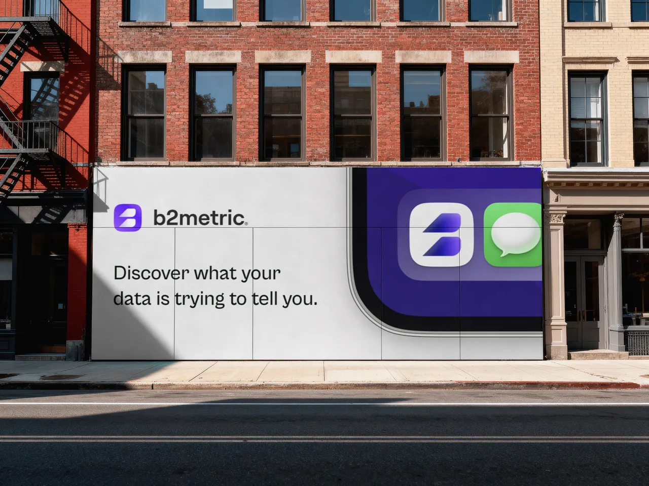 A modern building featuring a prominent wall sign with logos and text related to a business or service.